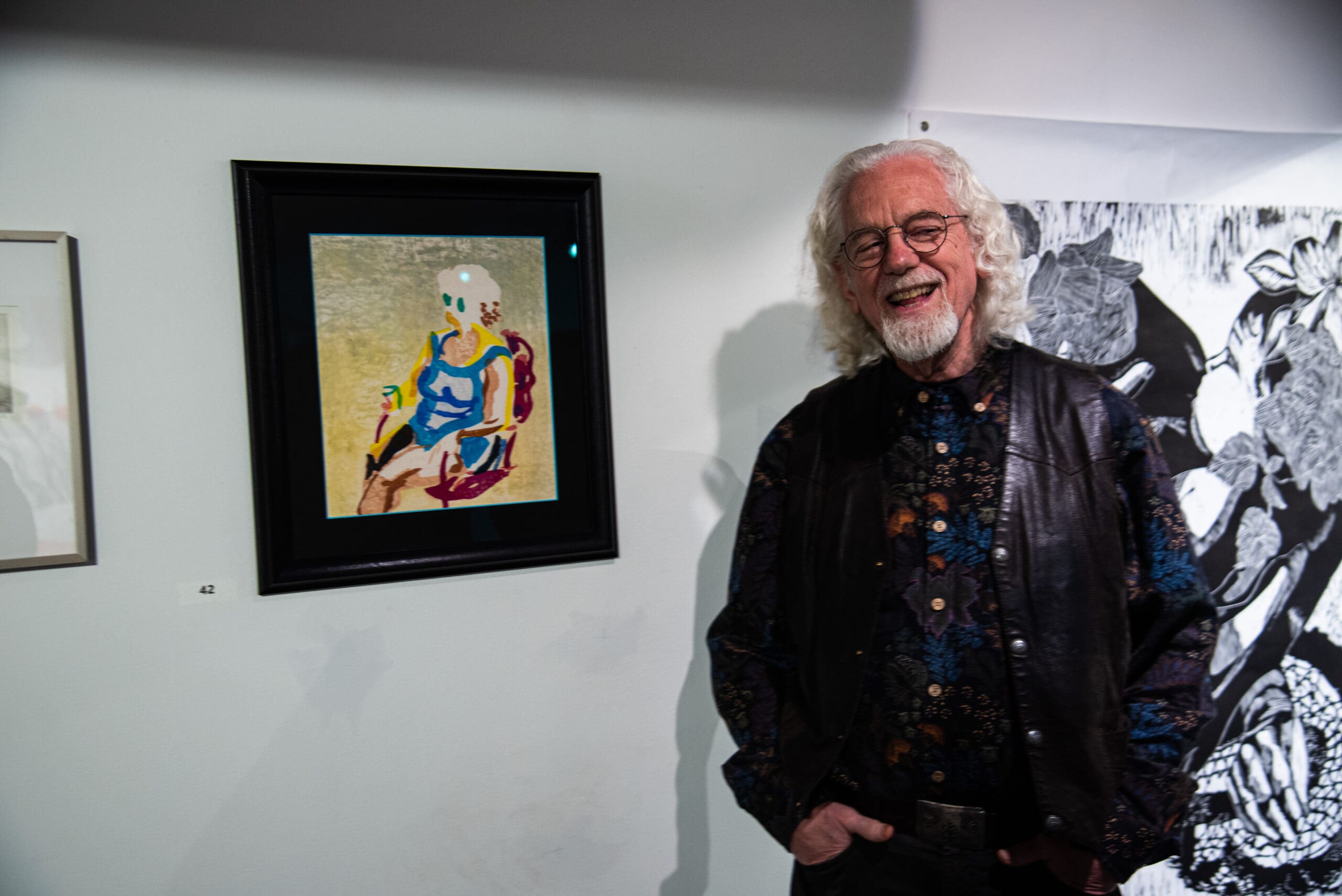 Artist Bill Murray stands with his print at the 2024 Printmakers Showcase Exhibition in Troy, NY